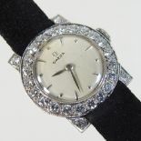 A vintage Omega platinum and diamond cased ladies cocktail watch, the signed dial,