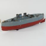 A Sutcliffe World War II steam powered tin plate toy battleship, painted in grey,