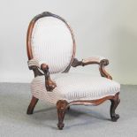 A Victorian walnut show frame armchair