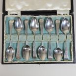 A matched set of eight silver teaspoons, with bright cut decoration,