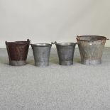 A pair of small metal pails, together with two larger,