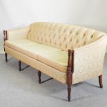 A 20th century button back sofa, of Georgian design, upholstered in yellow paisley pattern up,