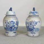 A pair of modern Chinese blue and white ginger jars and covers,