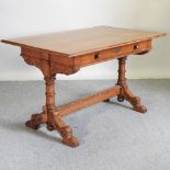 A 19th century light oak side table, in the manner of Pugin, containing one long drawer,