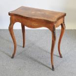 A Louis XVI style kingwood serpentine card table,