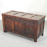 An 18th century and later carved oak coffer,