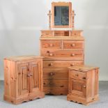 A modern pine chest of drawers, 89cm, together with a swing frame mirror, a bedside cabinet,