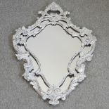 A white painted wall mirror,