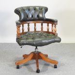A reproduction green upholstered button back swivel desk chair