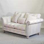 A modern grey striped upholstered sofa,