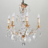 A French gilt metal and glass six branch chandelier,