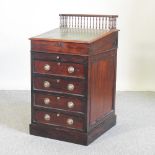 A 19th century mahogany slide top davenport,