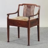 An Edwardian mahogany and inlaid piano stool, with a rising seat,