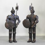 A pair of metal models of suits of armour,