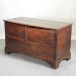 An 18th century oak cabinet, containing two rows of later drawers, enclosed by doors,