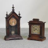 A 19th century American mantel clock, together with another clock larger,