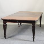 A Victorian mahogany wind-out dining table, with two additional leaves, 243 x 120cm overall,