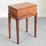 An handmade yew and inlaid sewing box, on stand,