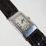 A vintage Omega steel cased wristwatch, the signed rectangular dial with Arabic hours,