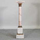 A gilt metal mounted pink veined marble pedestal, in the form of a Corinthian column,