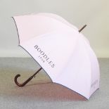A Boodles designer pink umbrella