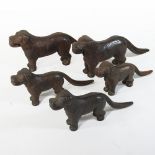A collection of five 19th century cast iron novelty nut crackers, each in the form of a dog,