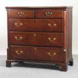 A 19th century Lancashire style oak chest, containing two short over three long drawers,