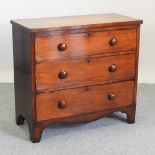 A Victorian flame mahogany chest, containing three graduated drawers, on bracket feet,