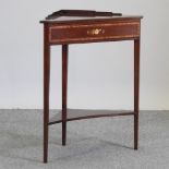 A 19th century style mahogany and inlaid corner table,