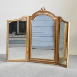 An early 20th century gilt painted triple dressing table mirror,
