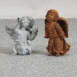 A model of an angel blowing a kiss, together with a model of an angel blowing a trumpet,