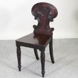 A William IV carved mahogany hall chair,