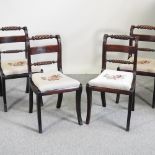 A set of four Regency mahogany dining chairs,