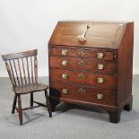 A George III oak bureau, on bracket feet, 86cm,