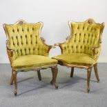 A pair of modern gilt painted yellow upholstered button back armchairs