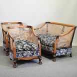 A 1920's single cane walnut bergere suite, to include a sofa, 172cm and two chairs,