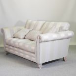 A modern grey striped upholstered sofa,
