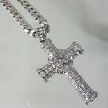 A large 14 carat white gold diamond cross pendant,