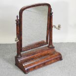 A Regency walnut swing frame toiletry mirror,