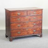 A George III mahogany chest of drawers, on bracket feet,