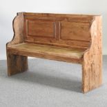 A rustic pine pew,