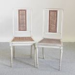A pair of white painted side chairs,