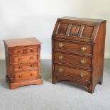 A 20th century linen fold bureau, together with a small modern hardwood chest,