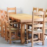 A light oak draw leaf dining table, 310 x 90cm overall,