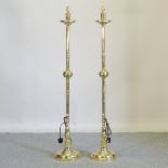 A pair of brass standard lamps,