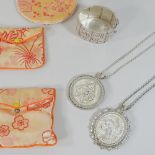Withdrawn - Two mid 20th century Singapore white metal pendant necklaces, unmarked,