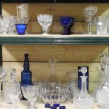 Two shelves of 18th century and later glassware, to include decanters,