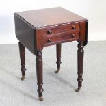 A Victorian mahogany occasional table, with a hinged top, on turned legs, terminating in castors,