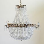 An Empire style gilt metal and glass five branch chandelier,