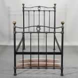 A Victorian style black painted metal single bedstead,